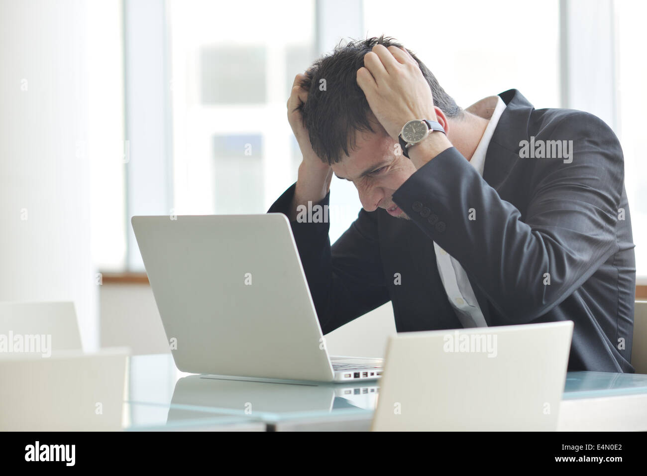 young business man alone in conference room Stock Photo - Alamy