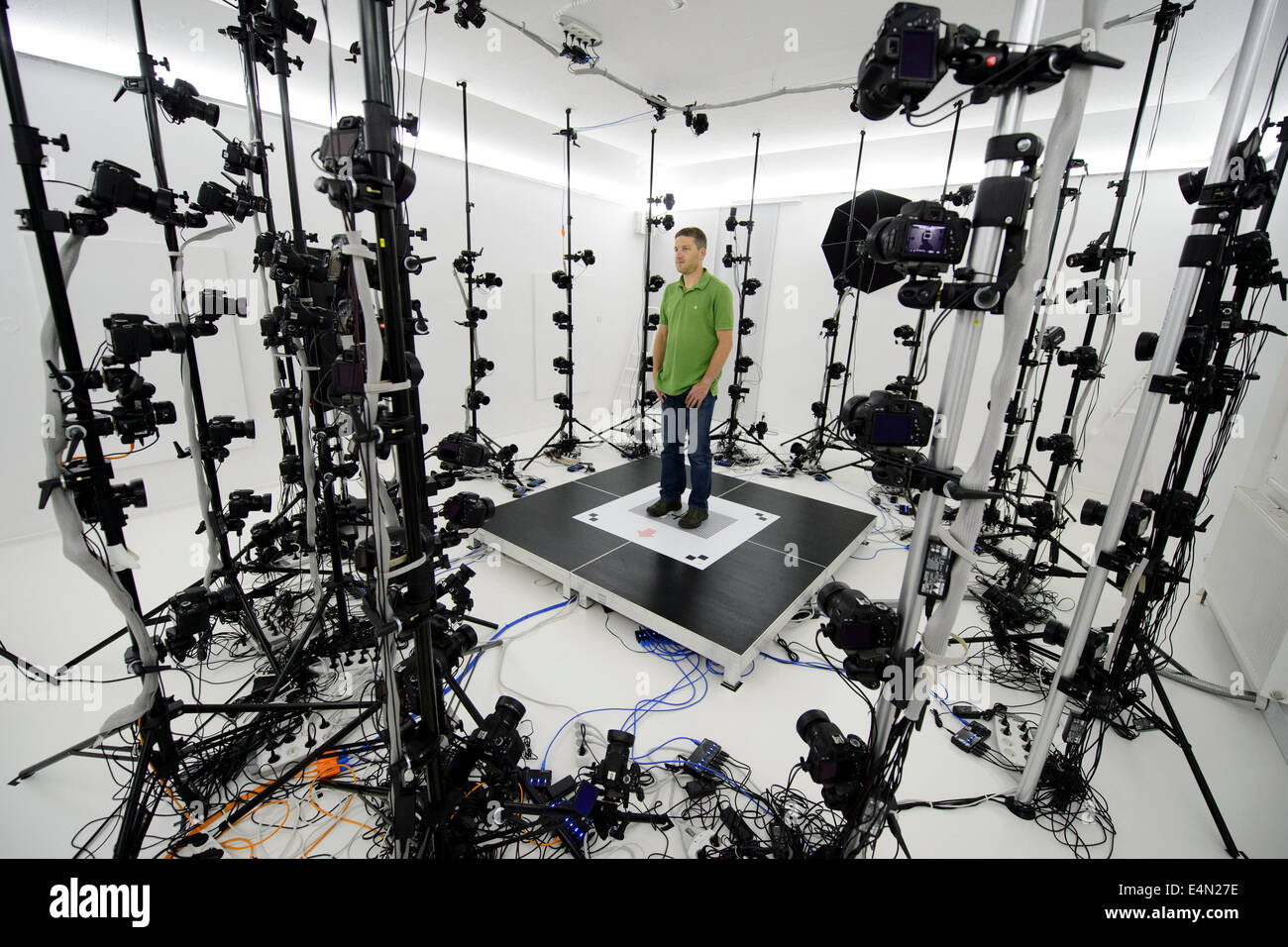 The largest 3D scanner in Europe is designed to scan objects, people or animals and it is composed of 115 sensors with a total resolution of over one gigapixel. The price of this device is around six million Czech crowns. The actual scan takes from 5 to 15 minutes. Then the computer creates a three-dimensional model, with which you can work. 3D gang company prints for example figurines of scanned persons in size from 15 to 35 cm. Martin Benes of the 3D gang company demonstrates each phase of the three-dimensional scanning in Prague, Czech Republic, July 9, 2014. (CTK Photo/Michal Kamaryt) Stock Photo