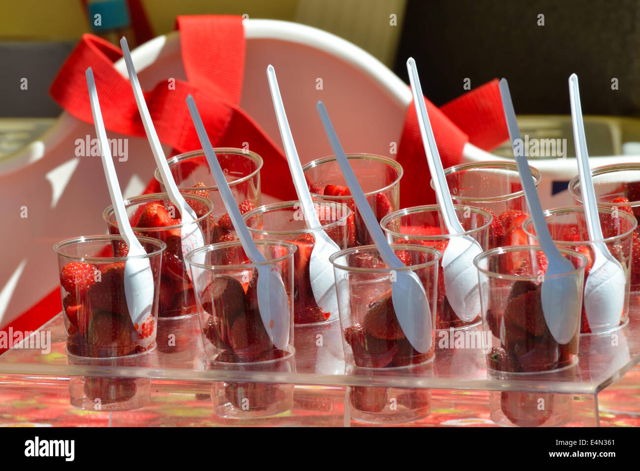 Rows of strawberries in plastic cups Stock Photo Alamy