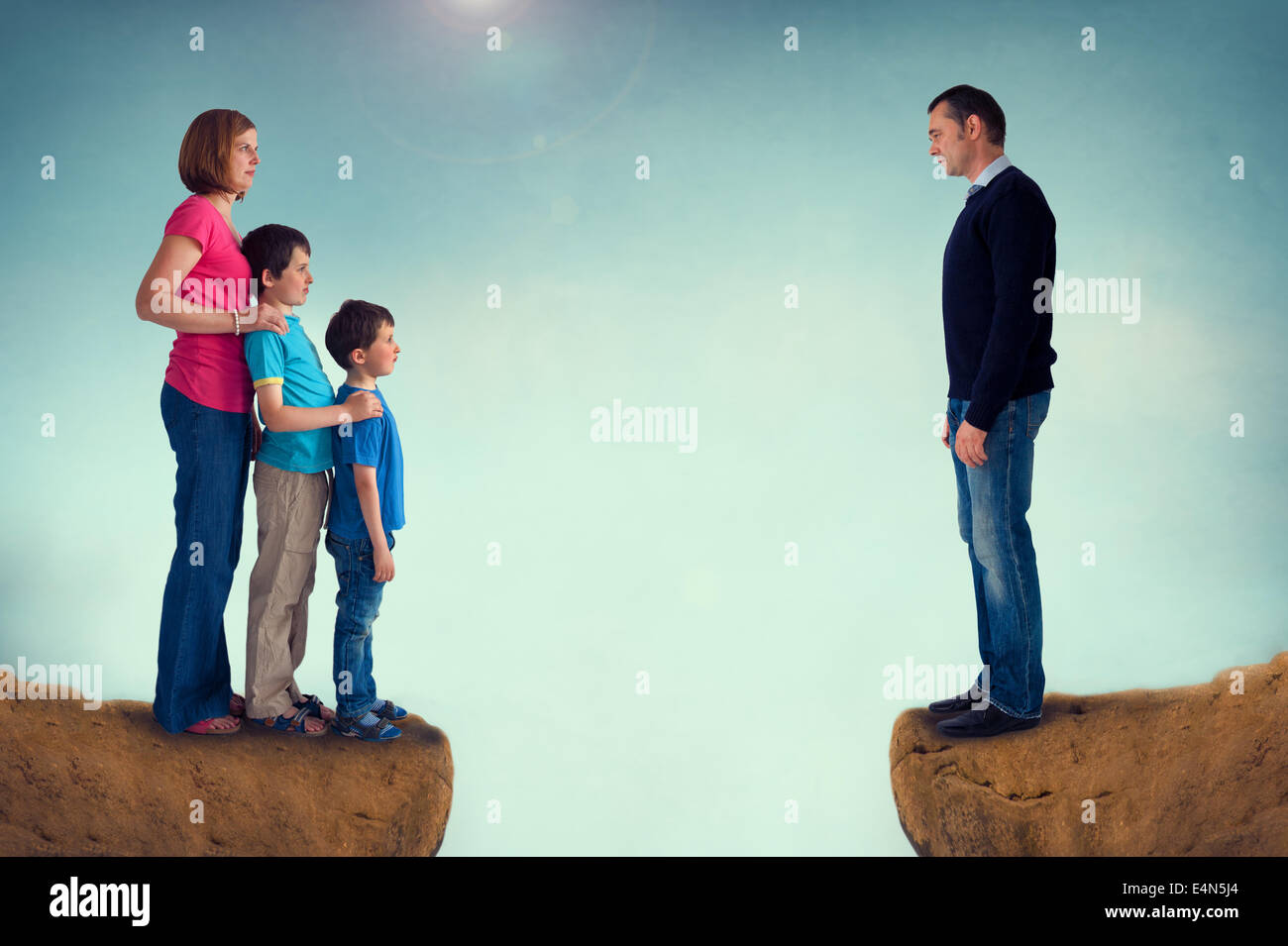divorce concept family separation man woman and children separated by a chasm Stock Photo
