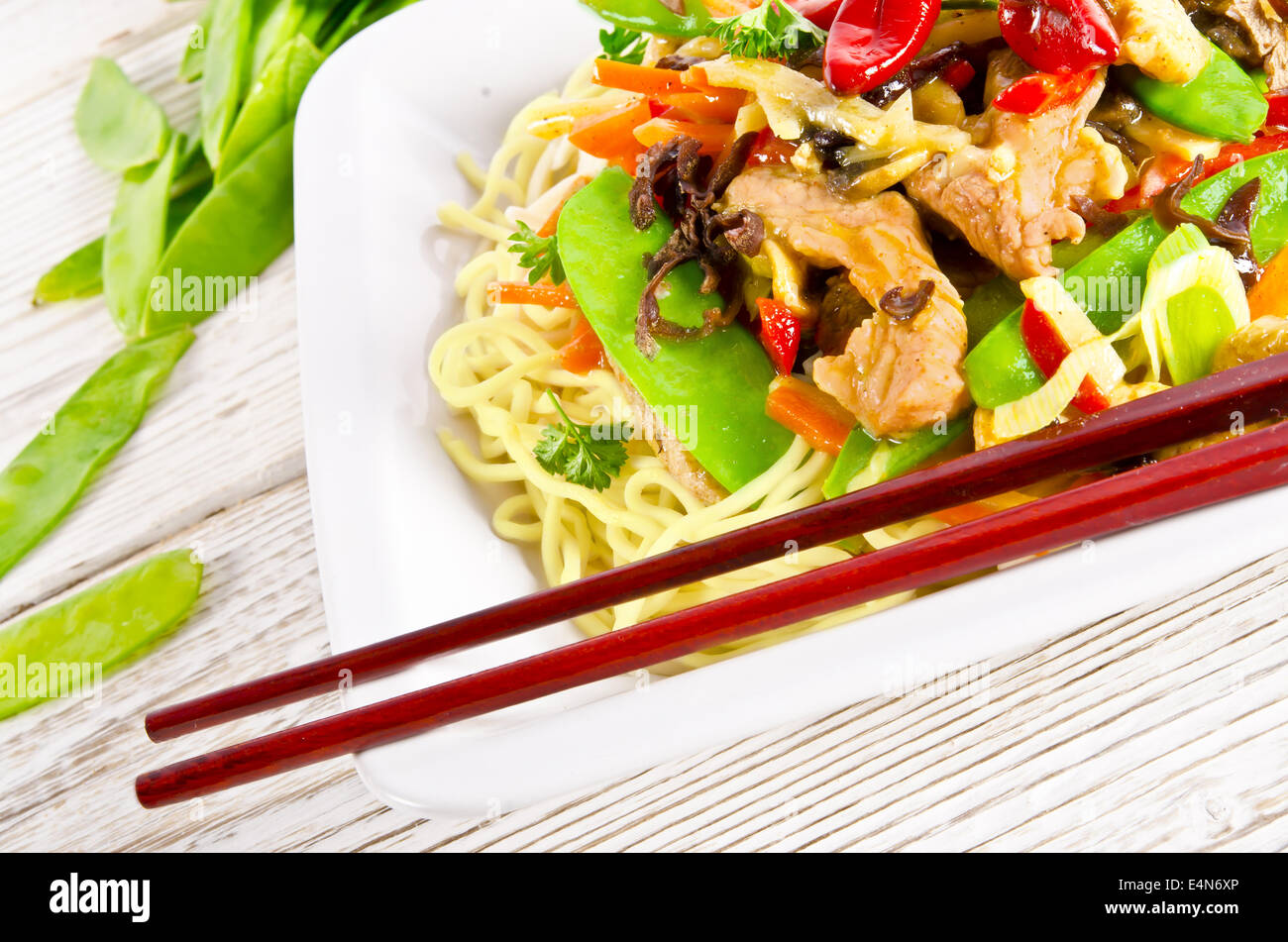 Noodles with pork and vegetables in plum sauce Stock Photo Alamy
