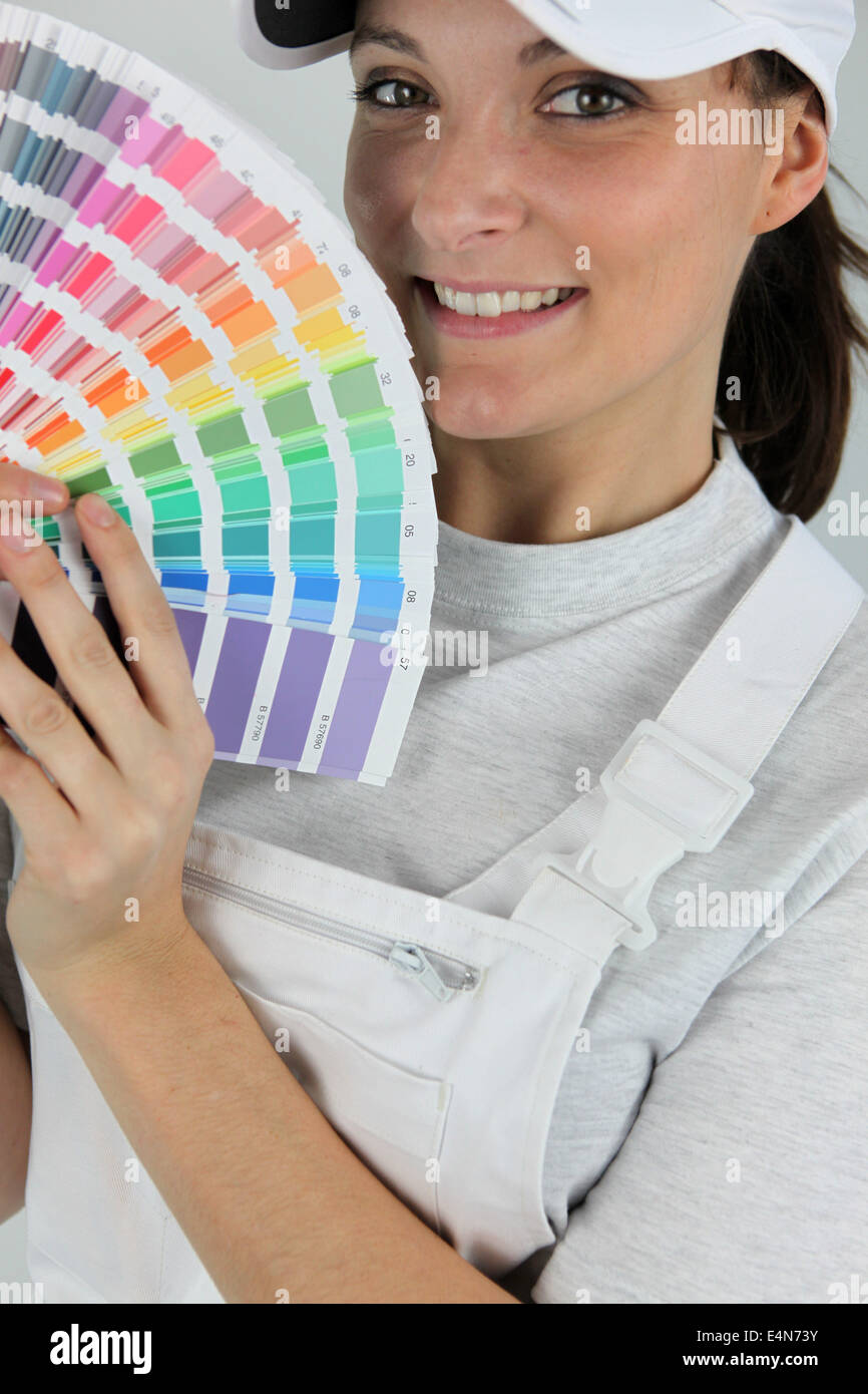female painter holding a color chart Stock Photo - Alamy