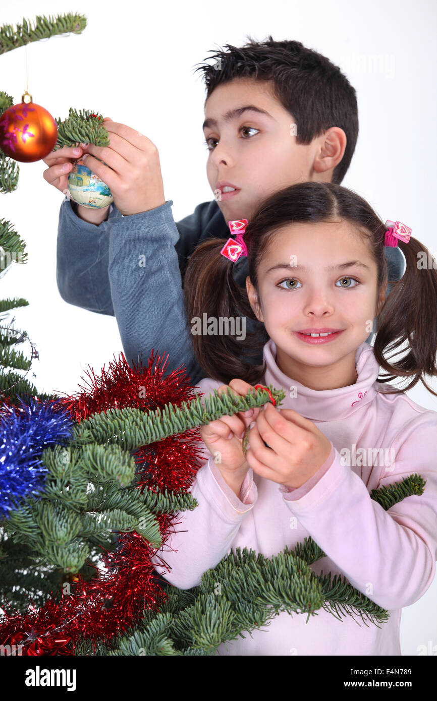 children decorating Christmas tree Stock Photo Alamy