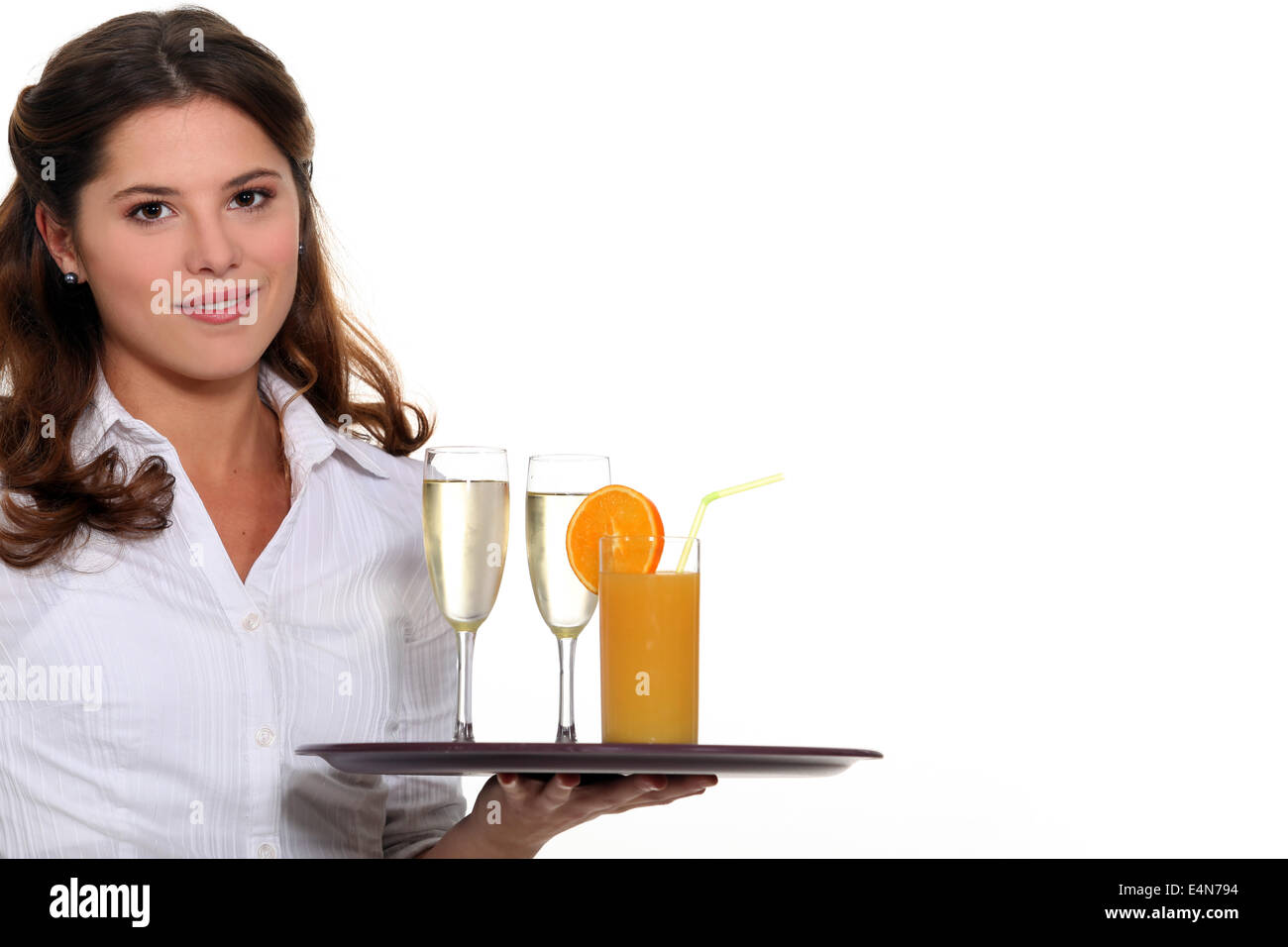 Waitress carrying tray of drinks Stock Photo Alamy