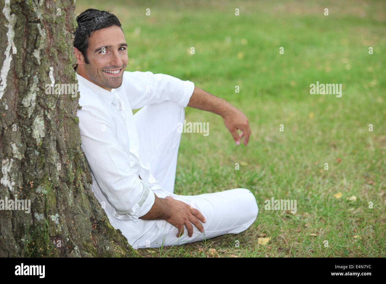 portrait of a man on the grass Stock Photo - Alamy