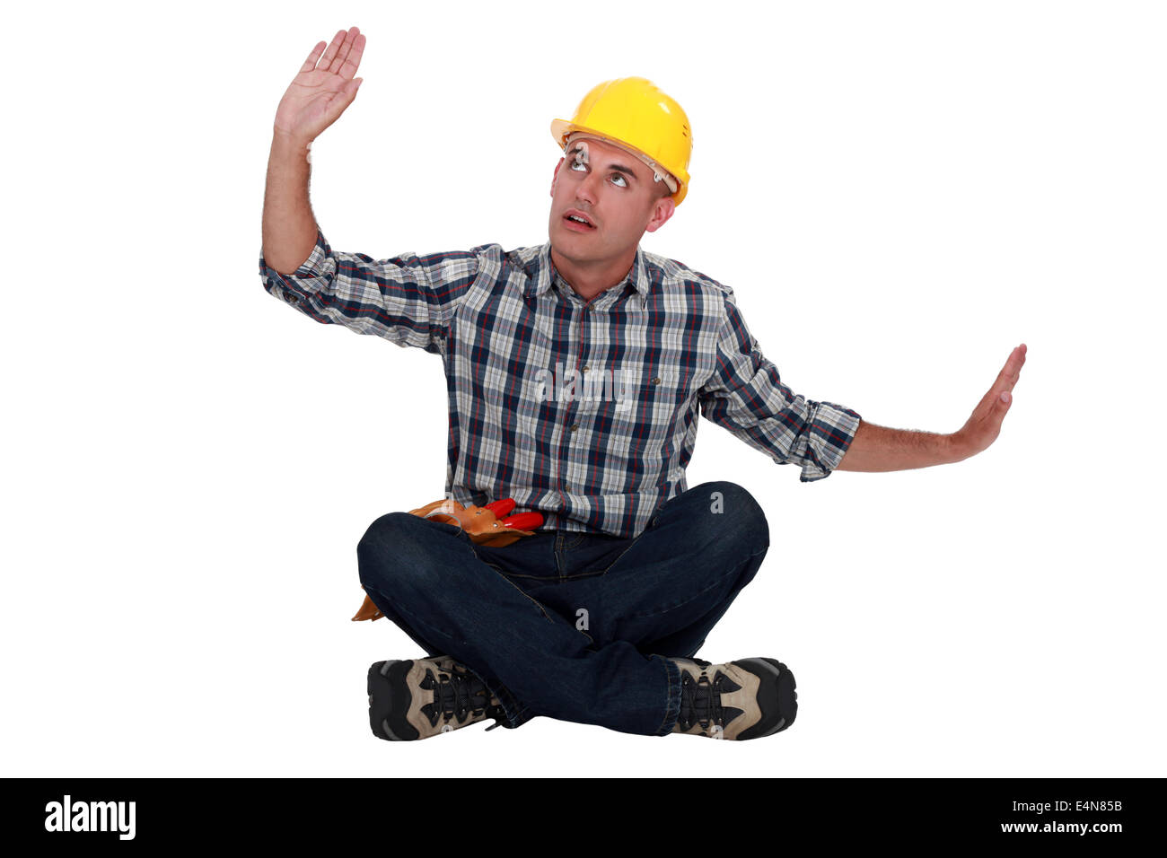 Workers sitting with arms outstretched Stock Photo