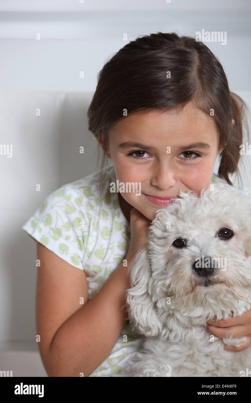 Little girl with white dog hi-res stock photography and images - Alamy