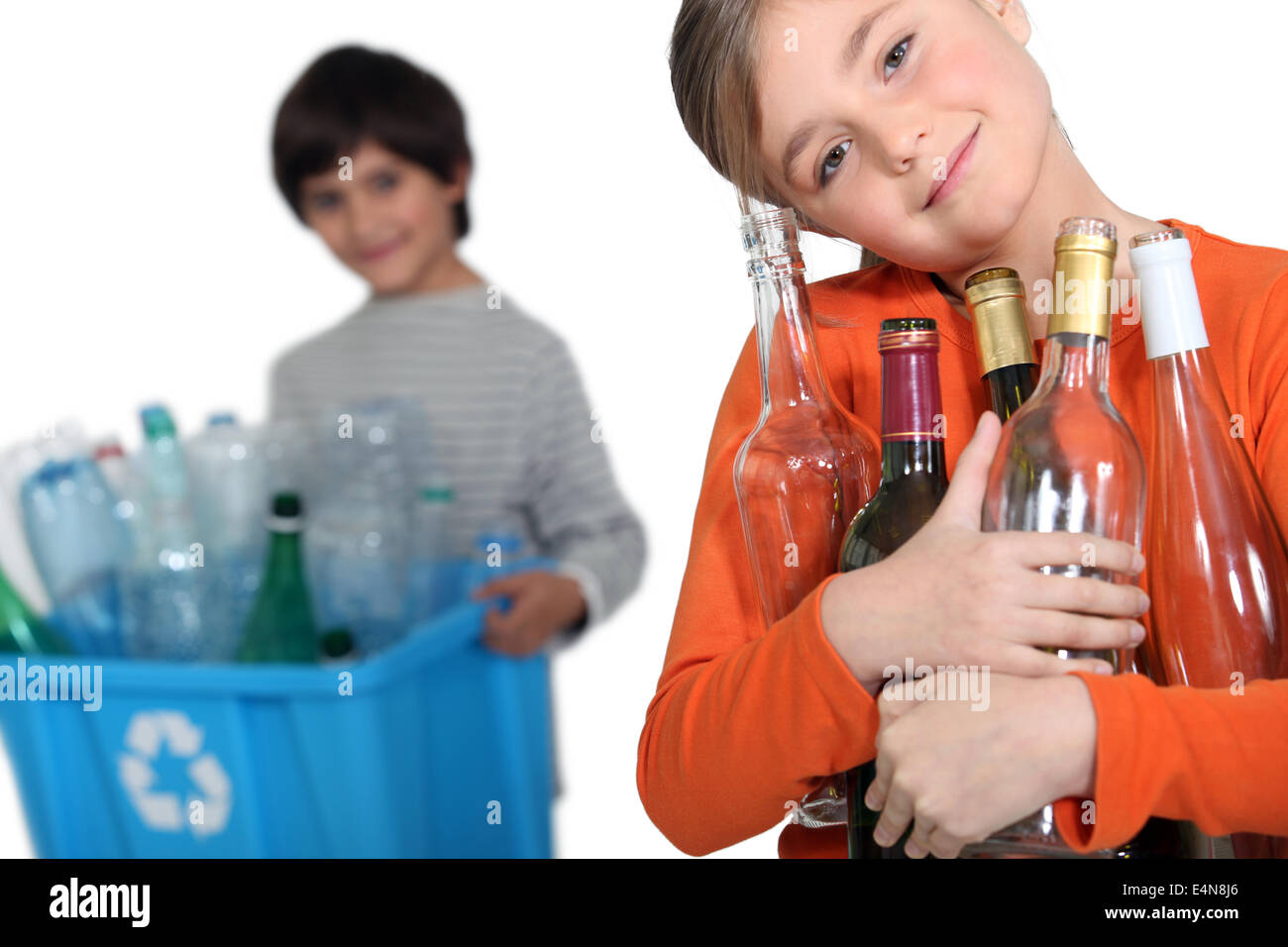 Kids recycling glass bottles Stock Photo Alamy