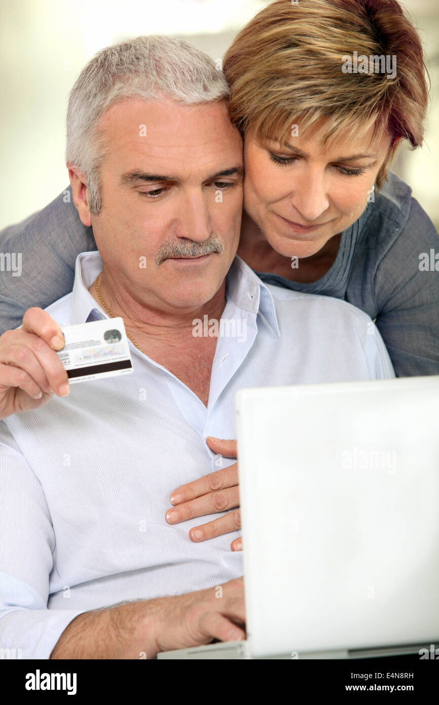 Couple shopping on-line Stock Photo