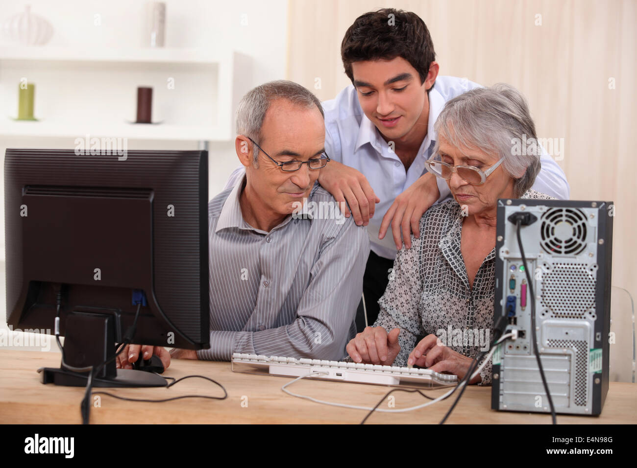 Family Using Computer 2000s Family on computer Stock Photo - Alamy