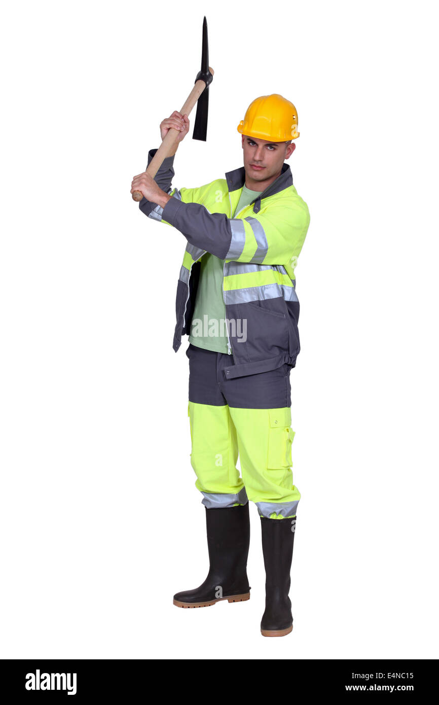 Construction worker with pick-axe Stock Photo