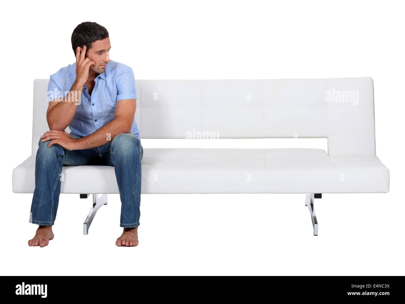 Man alone on the couch Stock Photo