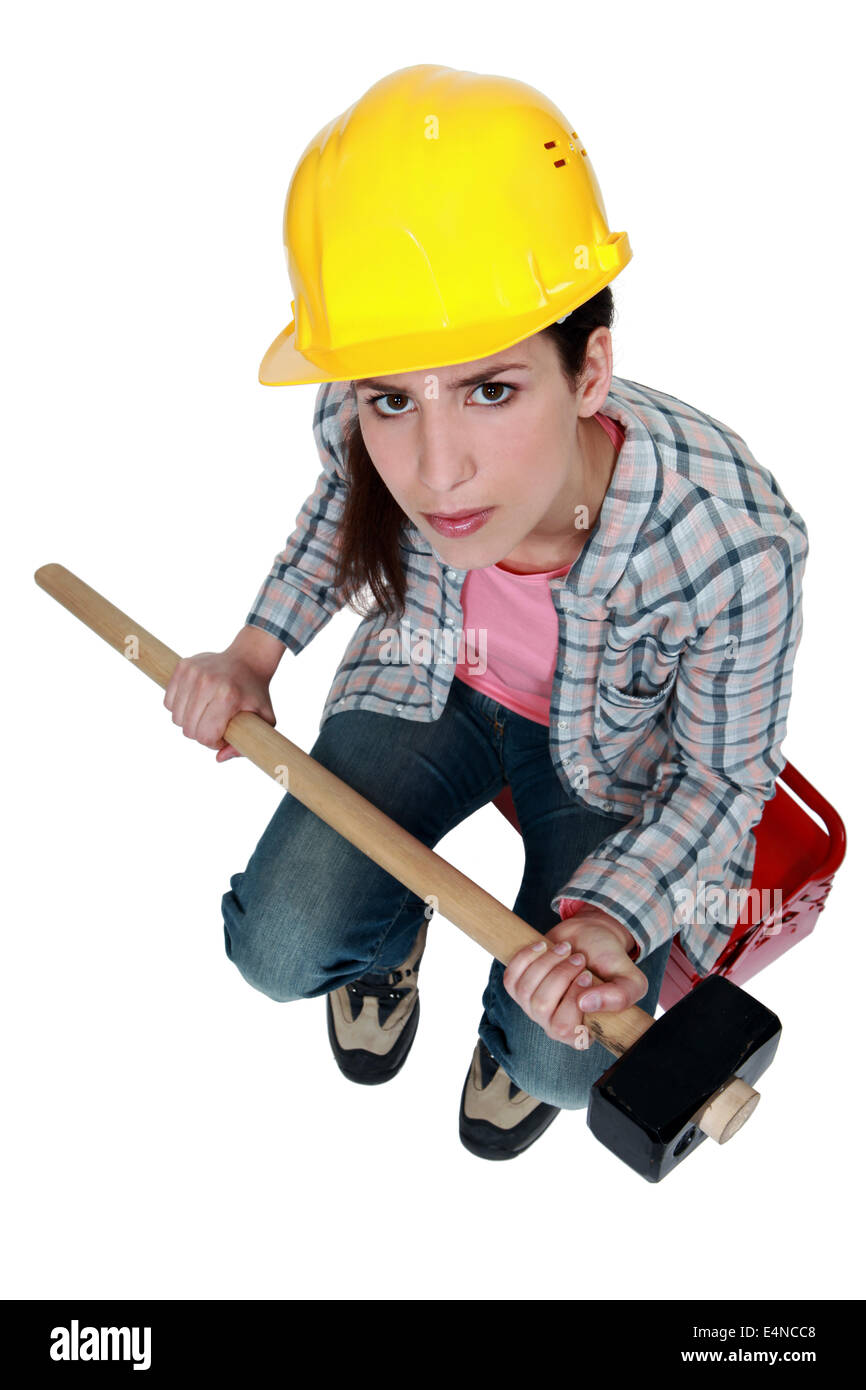 female builder holding a sledge hammer Stock Photo Alamy