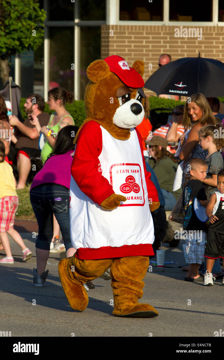 State Farm bear (American insurance company) in a parade. Stock Photo