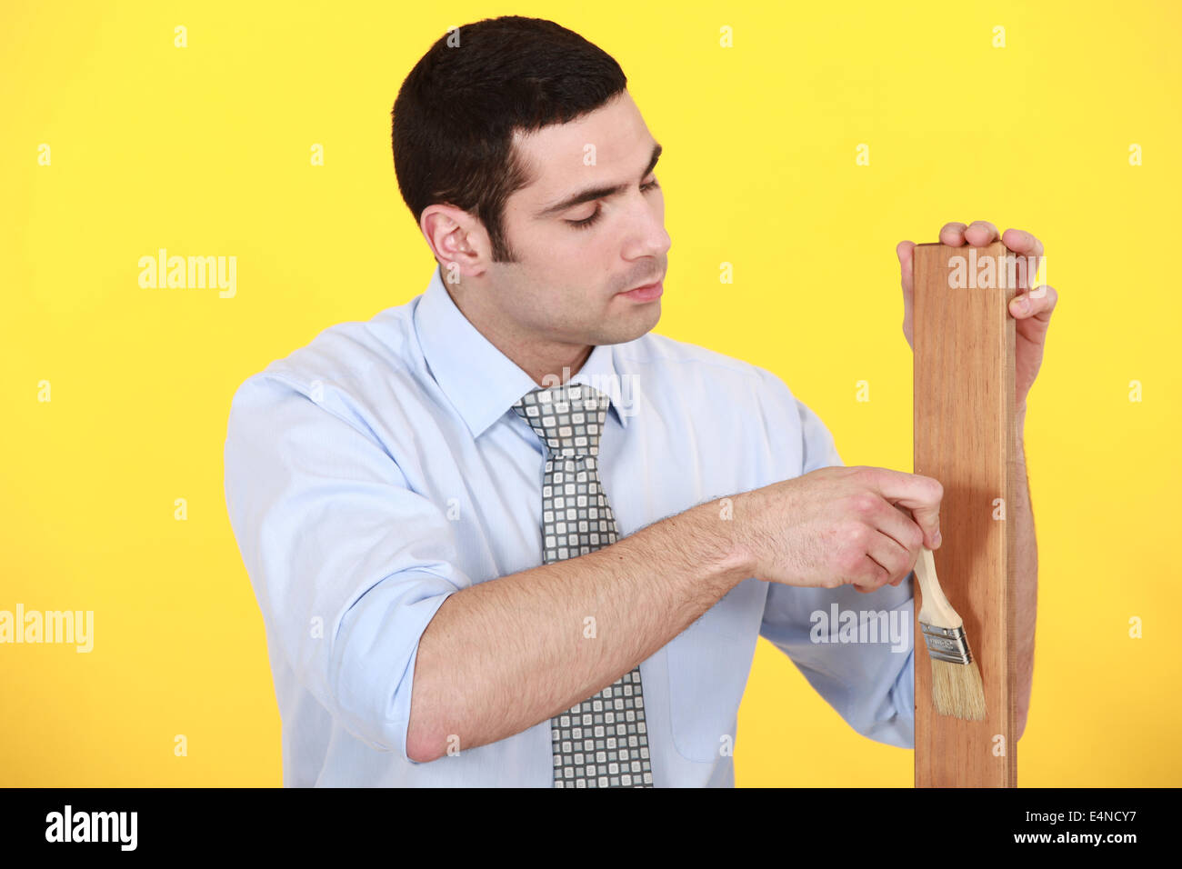Carpenter applying varnish Stock Photo Alamy