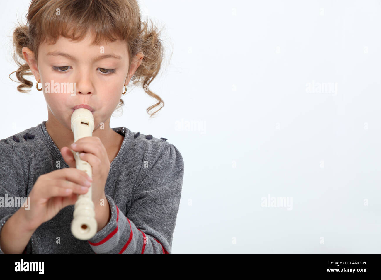Girl playing a recorder Stock Photo Alamy