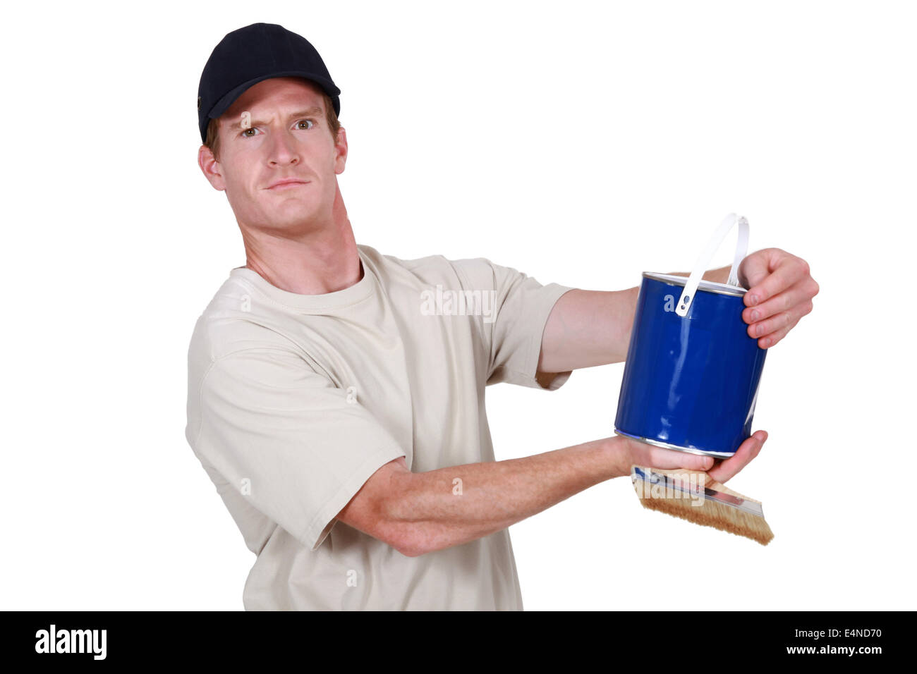 Decorator holding tin of blue paint Stock Photo Alamy