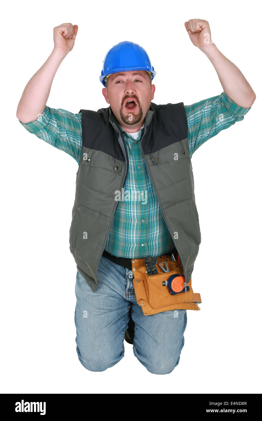 Construction worker on his knees Stock Photo