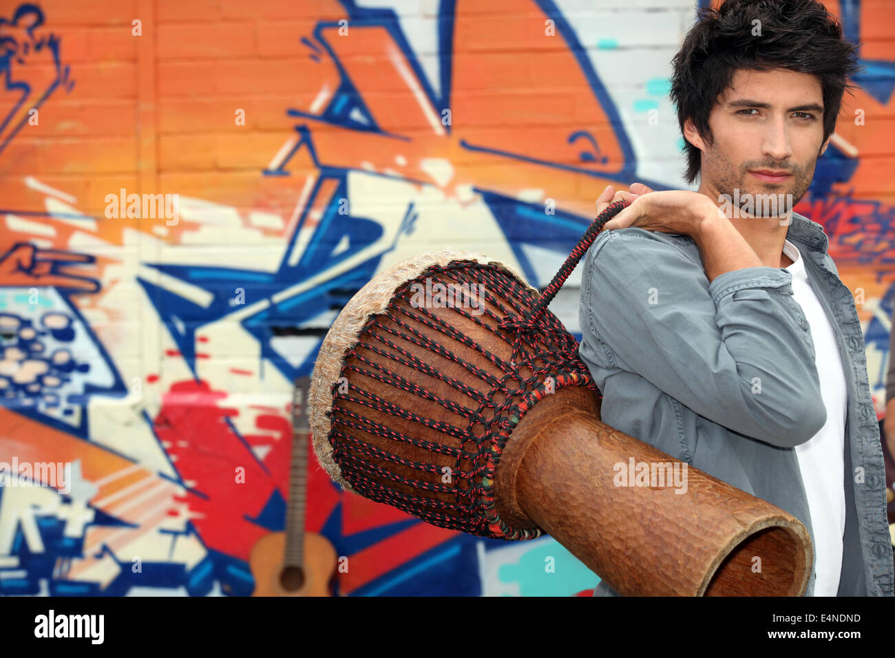 Guy with African drum Stock Photo - Alamy