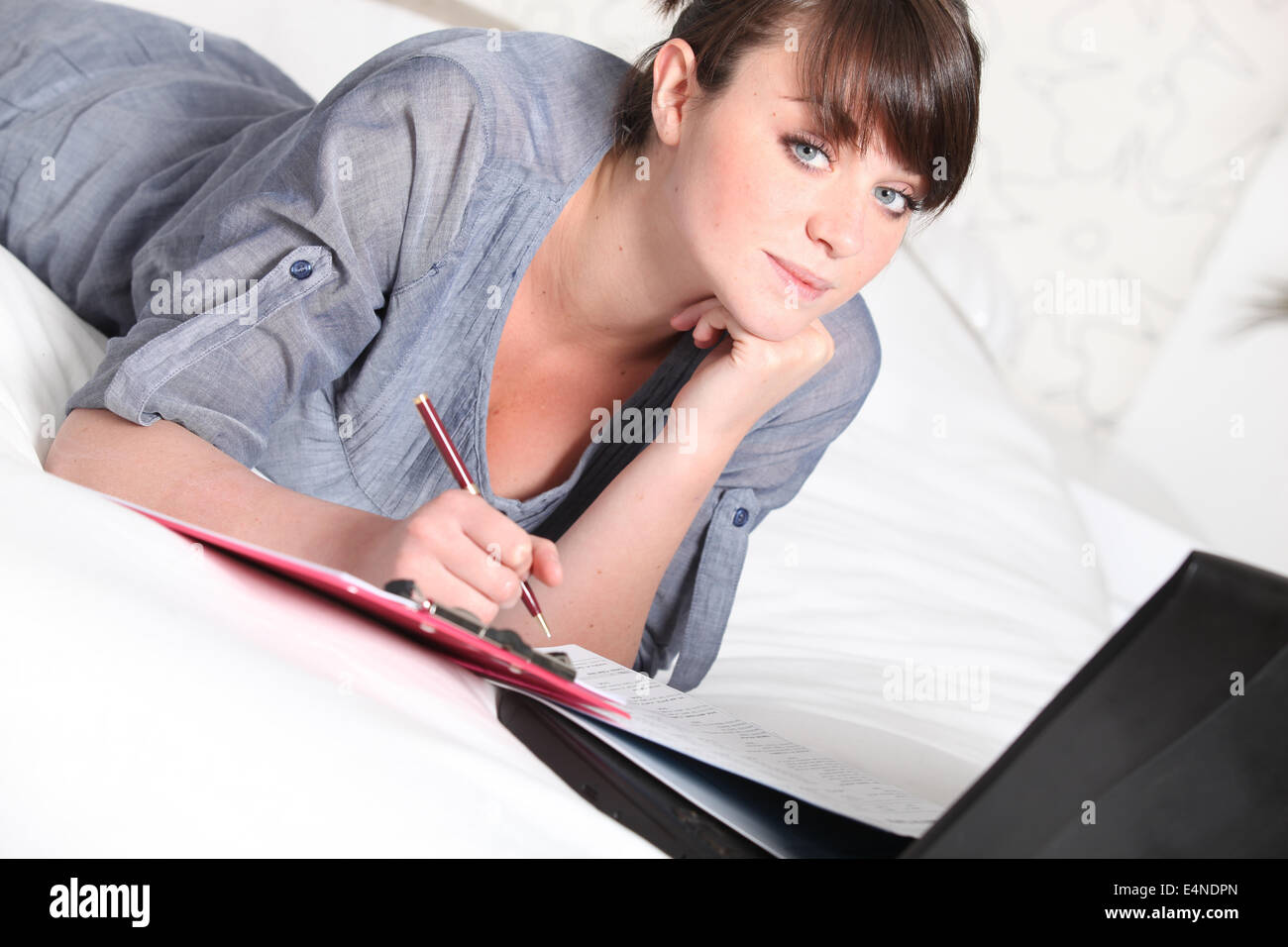 Teenage girl working on an assignment Stock Photo - Alamy