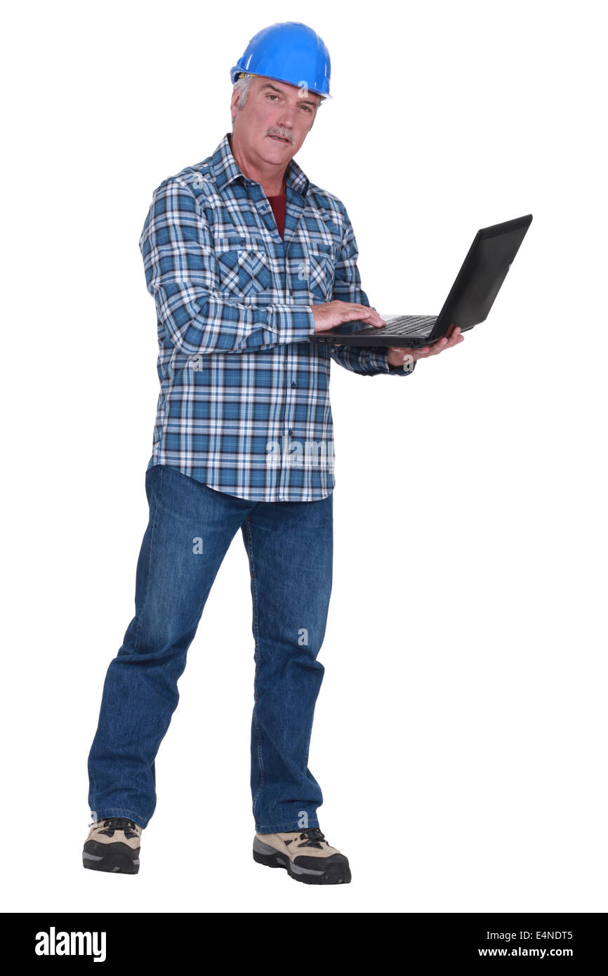 Experienced tradesman embracing technology Stock Photo