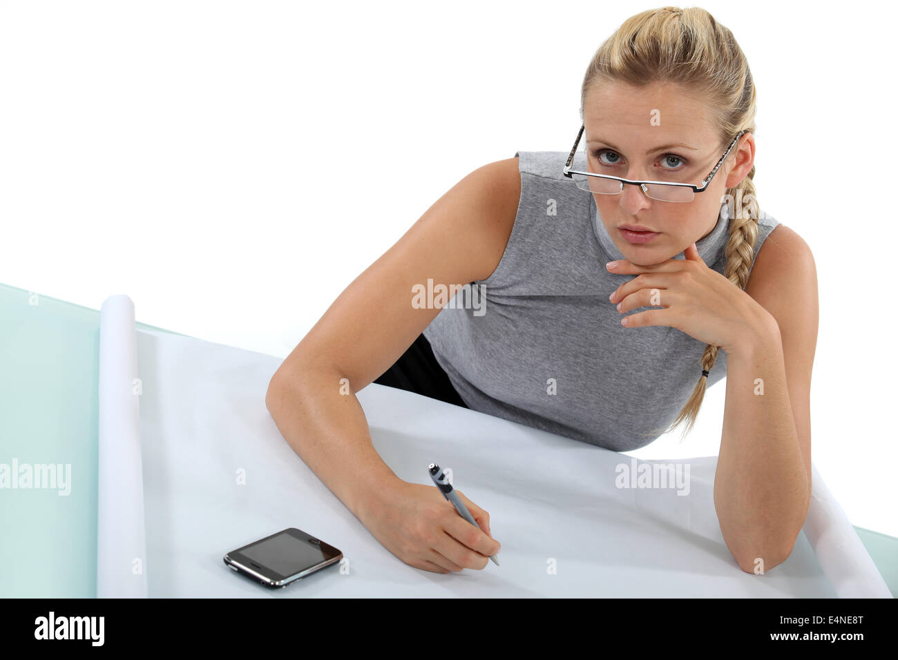 Woman drawing on sheet of paper Stock Photo