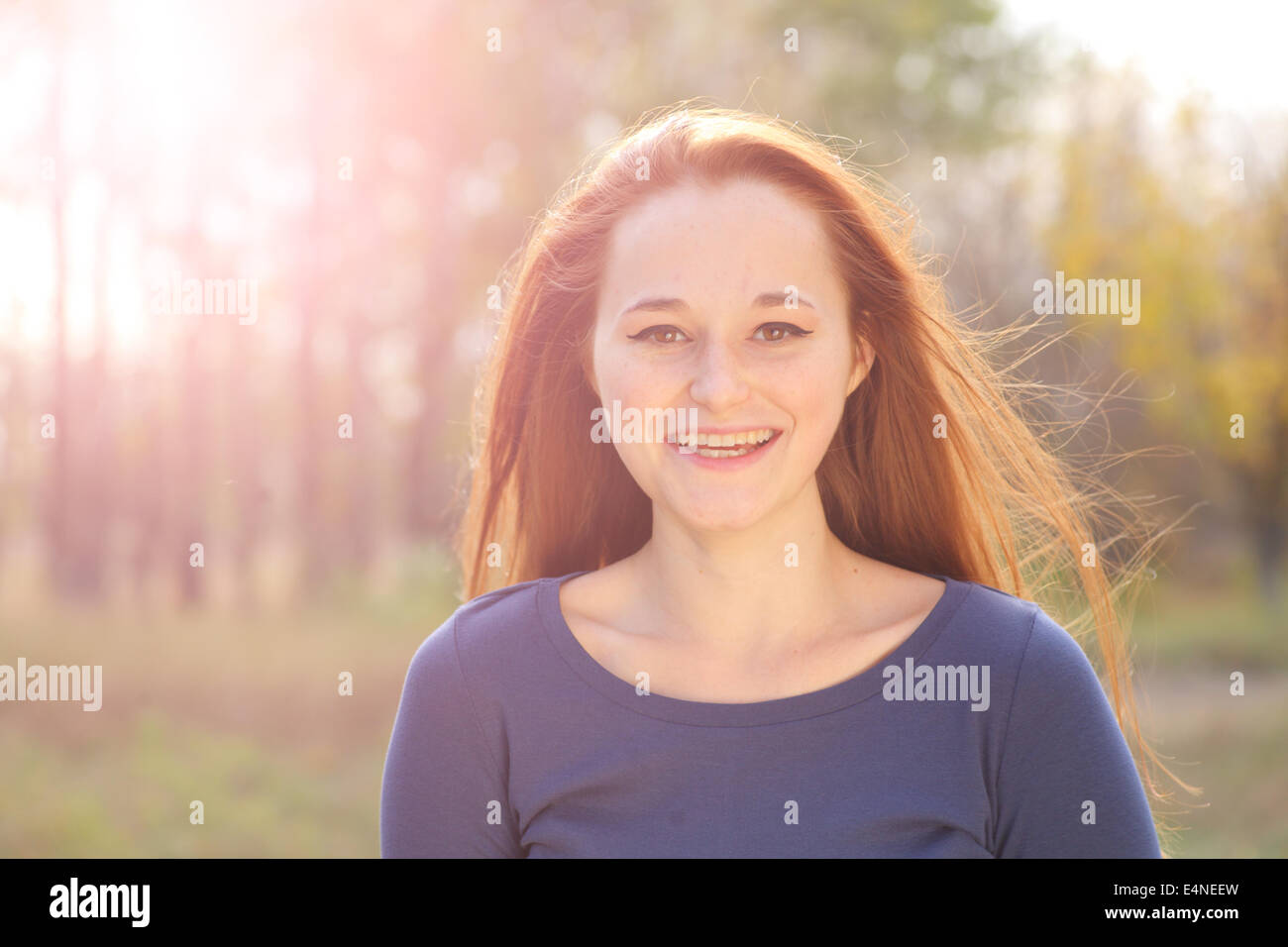 Young redhead woman in the park Stock Photo - Alamy