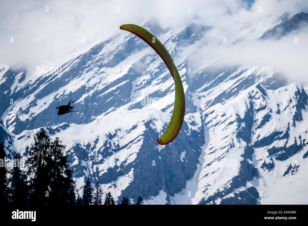 Paragliding in Himalayas. Solang Valley in Manali city of India is famous for it's adventure sports in the region. Stock Photo