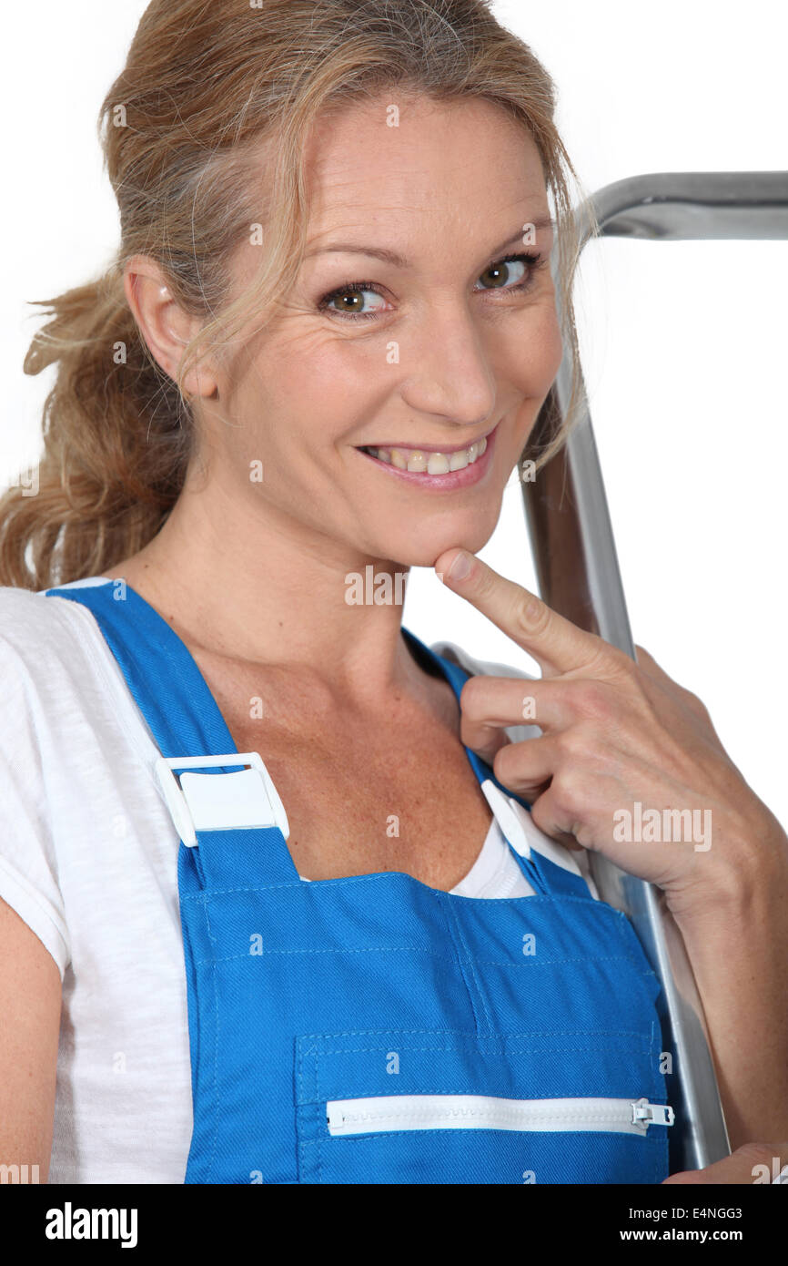 Woman in blue overalls Stock Photo