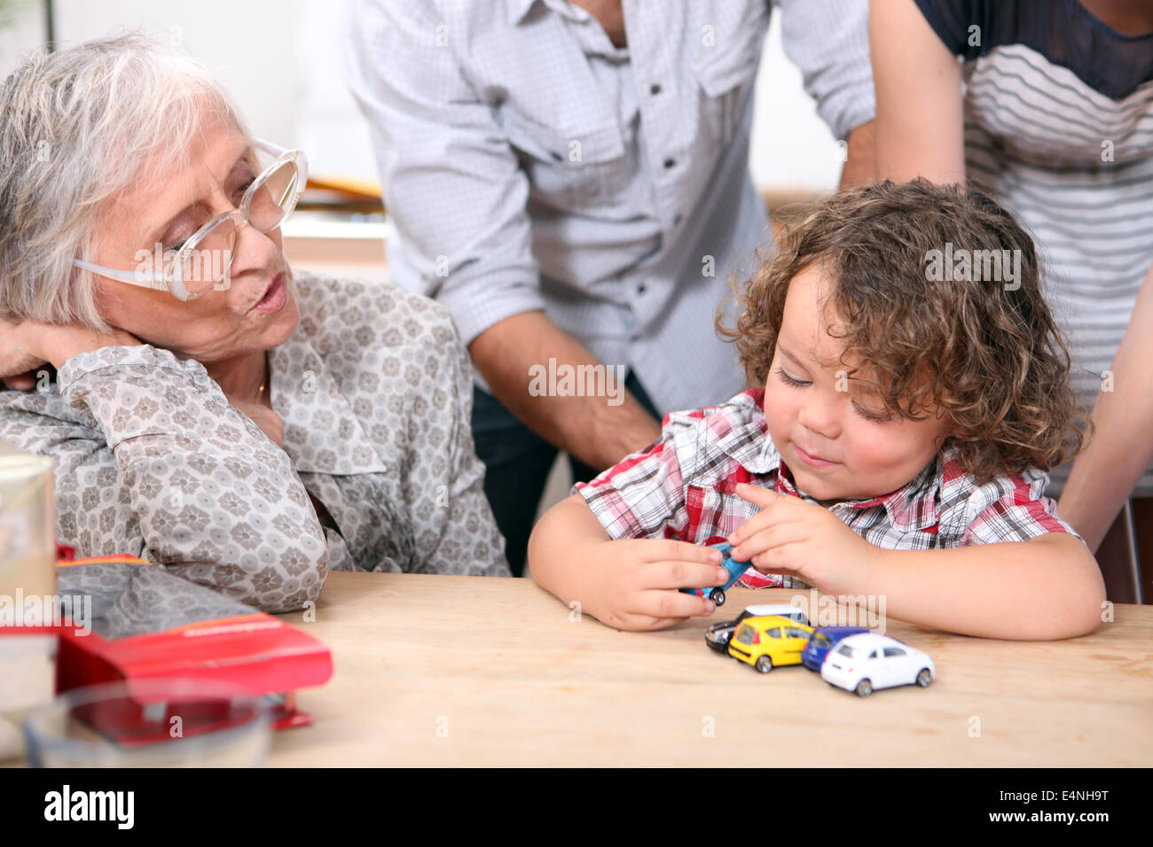 Little boy playing with toy cars Stock Photo