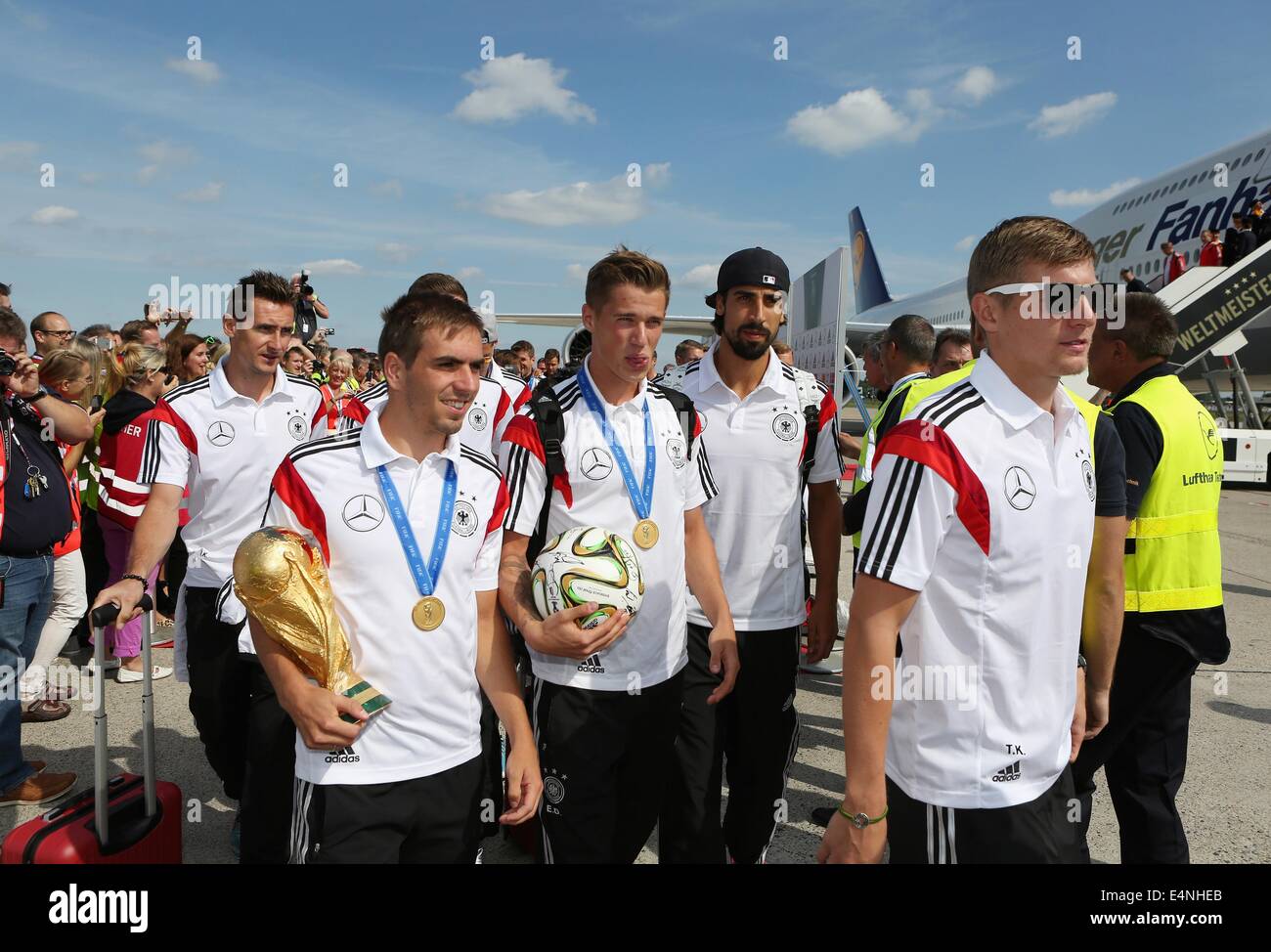 Berlin, Germany. 15th July, 2014. HANDOUT - A handout picture shows German national soccer players Miroslav Klose (L-R), Philipp Lahm, Lars Bender, Sami Khedira and Toni Kroos with the World Cup trophy ans a soccer ball in Berlin, Germany, 15 July 2014. Credit:  dpa picture alliance/Alamy Live News Stock Photo