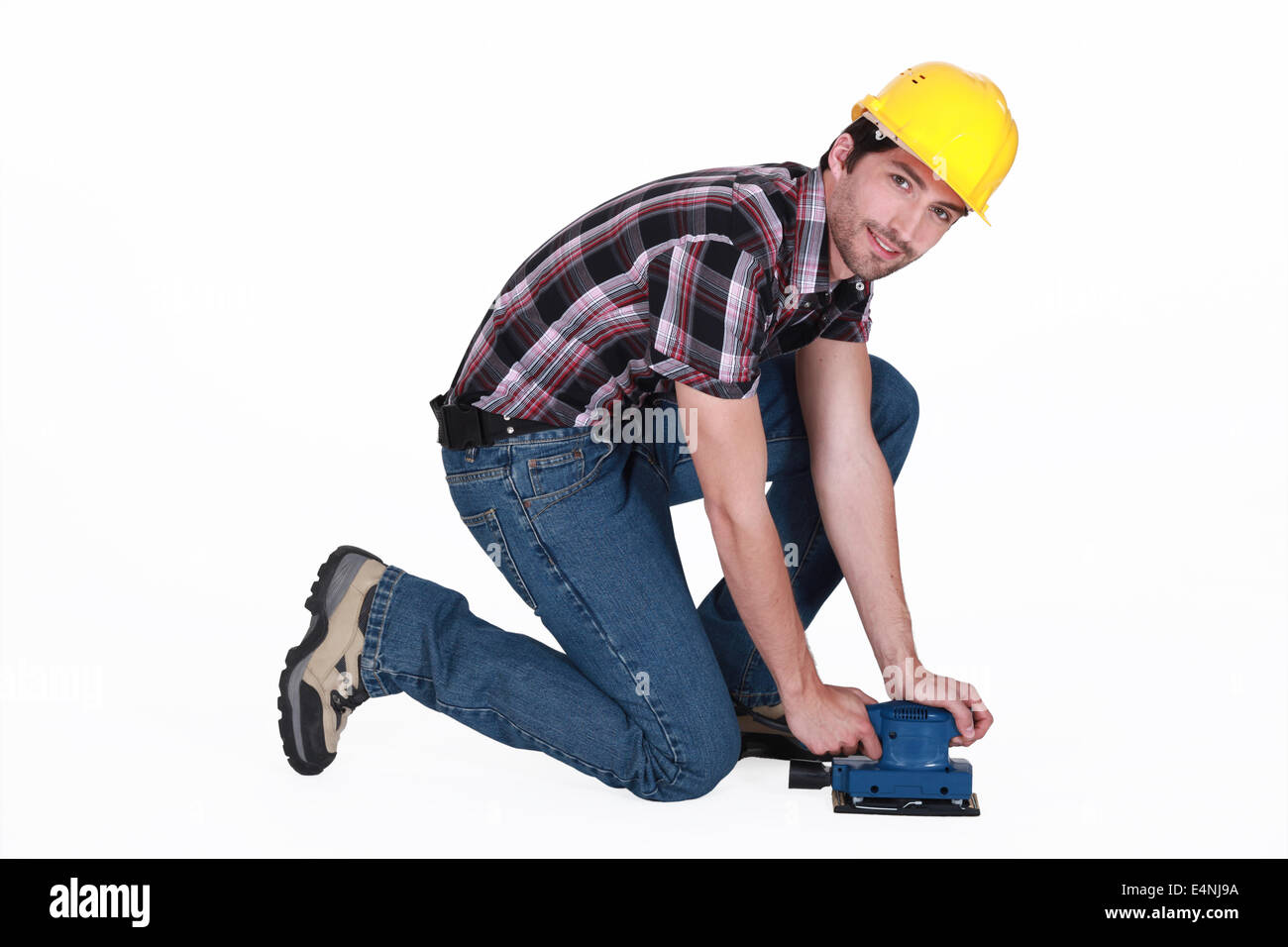 Tradesman using a sander Stock Photo