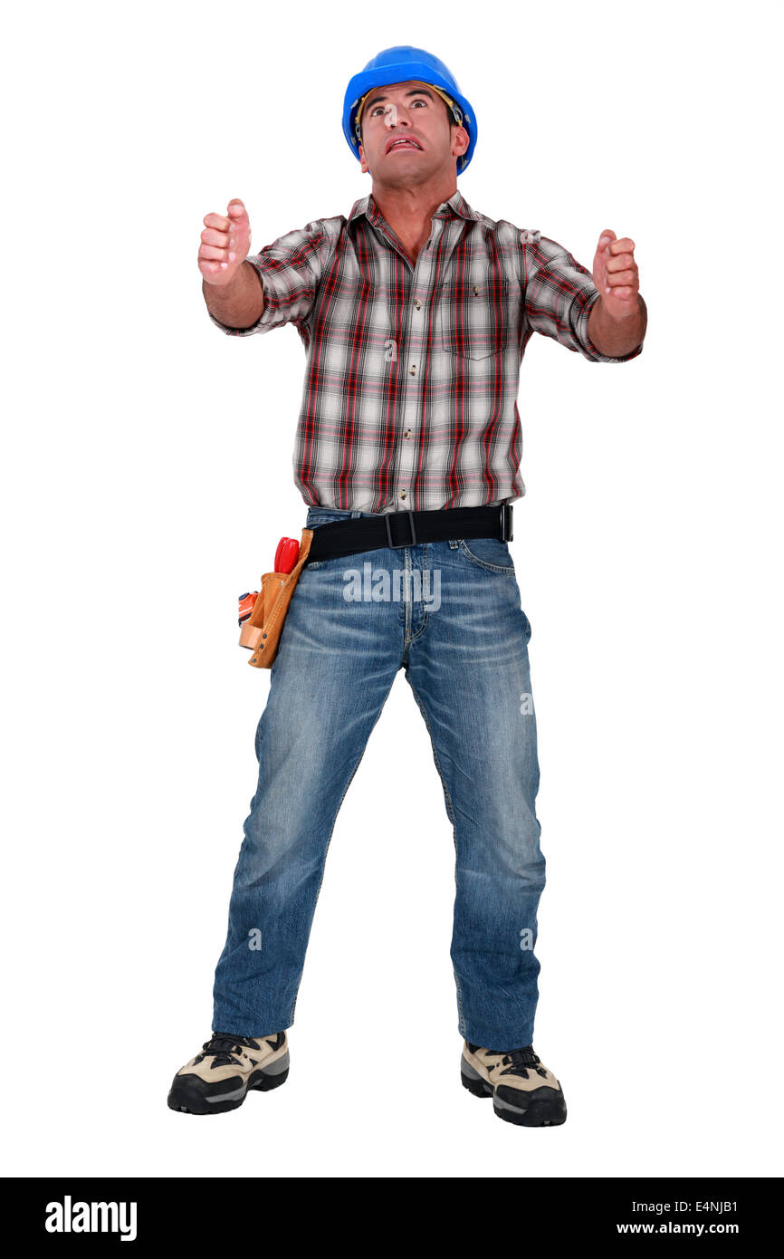 Laborer gripping an imaginary ladder Stock Photo