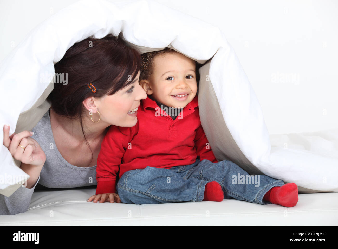 A mother and his son under a blanket Stock Photo Alamy