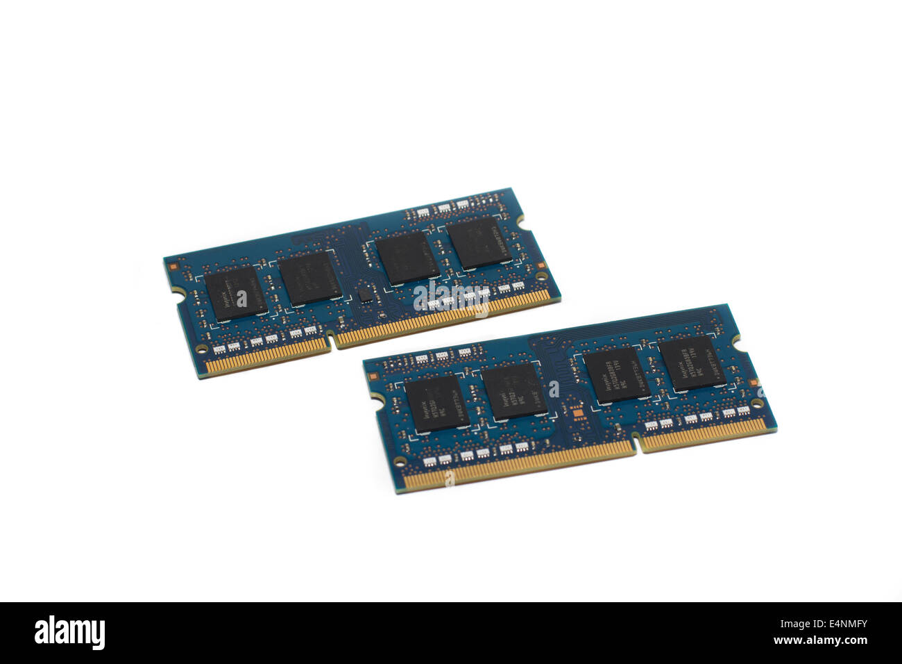 This image shows two RAM memory modules isolated on a white background, the gold connectors and wiring is visible Stock Photo