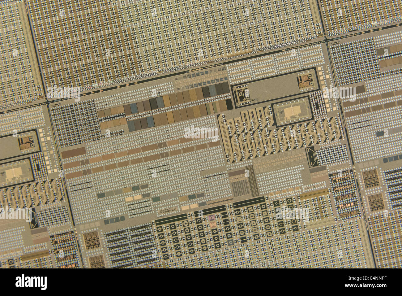 Semiconductor chip transistor detail with gold contact pads Stock