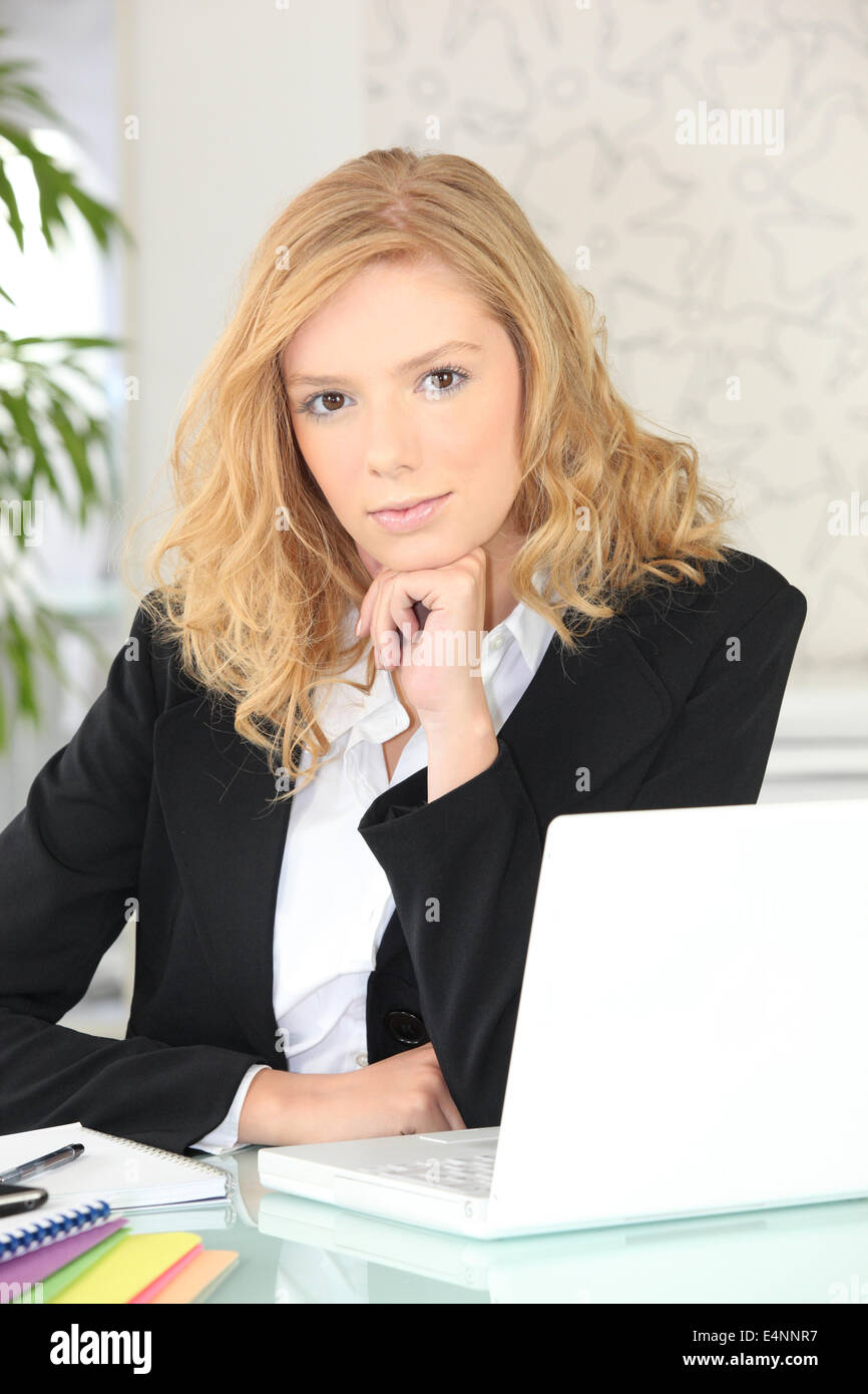 Young woman working at her laptop Stock Photo - Alamy