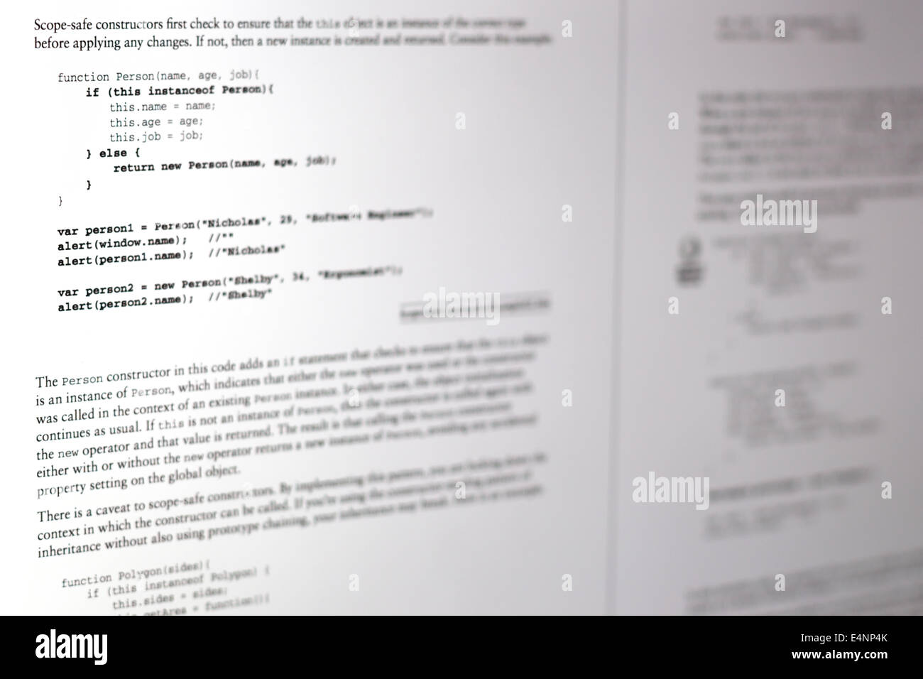 This image shows a javascript textbook being read on a digital screen, the code is highlighted in bold Stock Photo
