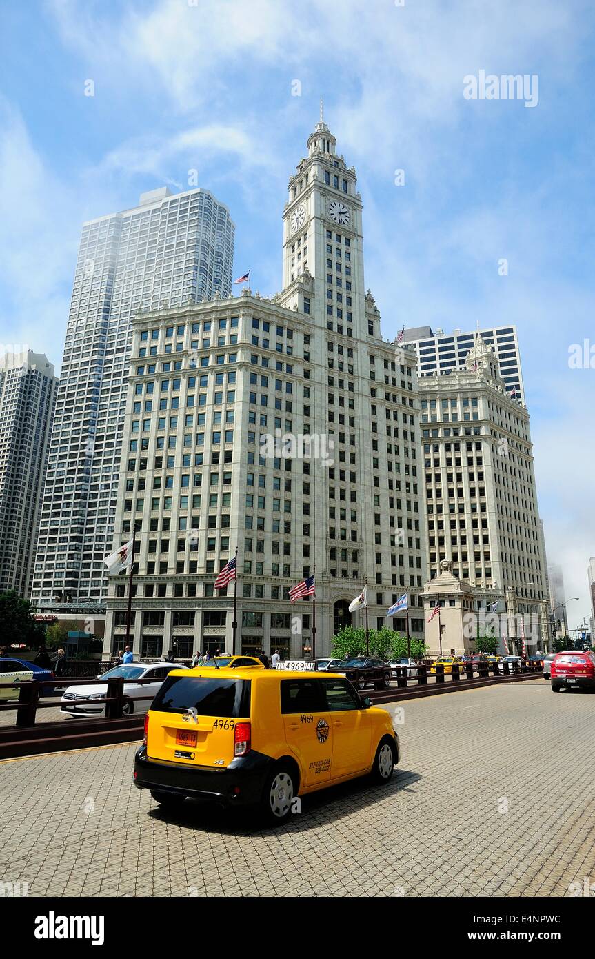 Taxi crossing the Du Sable bridge over the Chicago River. Wrigley Building. Stock Photo