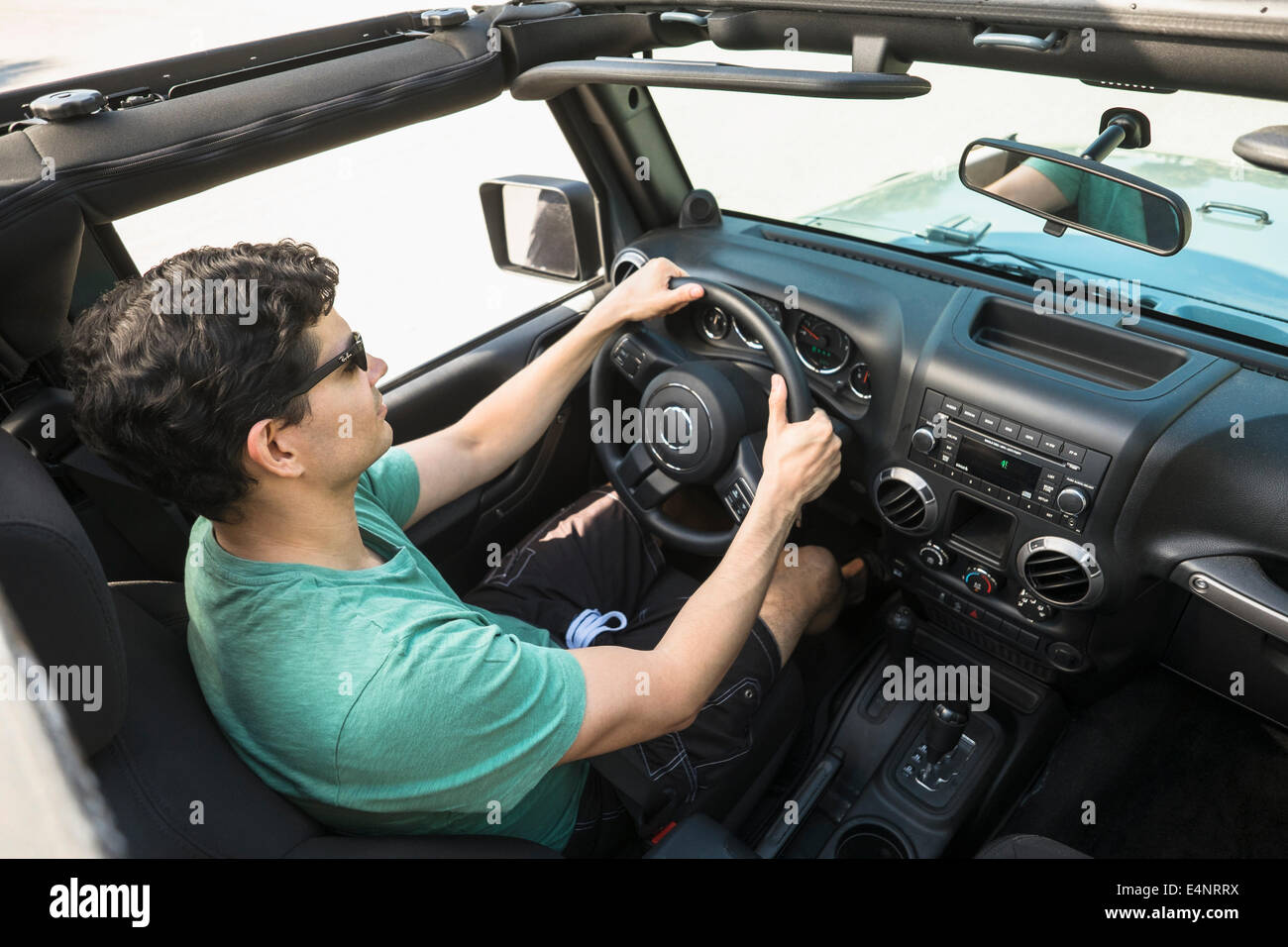 Elevated view of man driving car Stock Photo