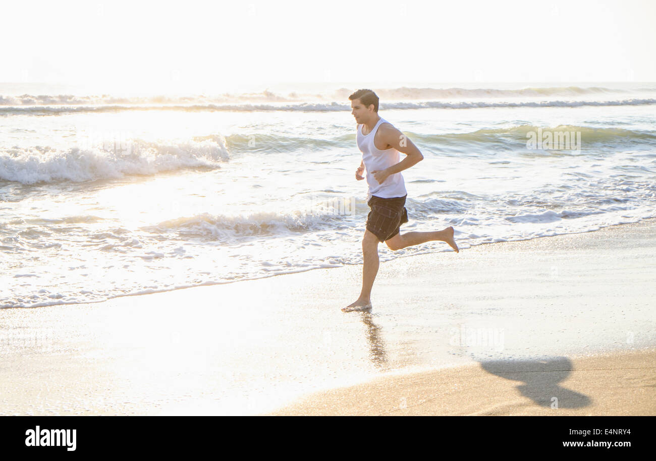 USA, Florida, Palm Beach, Man running on beach Stock Photo