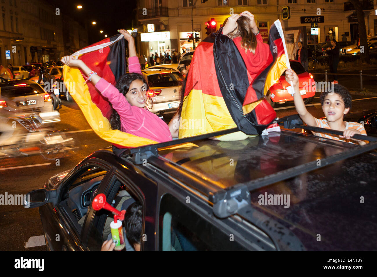 Wiesbaden, Germany. 14th July, 2014. Germany wins the FIFA World Cup 2014. People in their cars and on the street cheering and celebrating in downtown Wiesbaden after Germanys victory over Argentina in the final match. Some motion blur. Credit:  Oliver Kessler/Alamy Live News Stock Photo