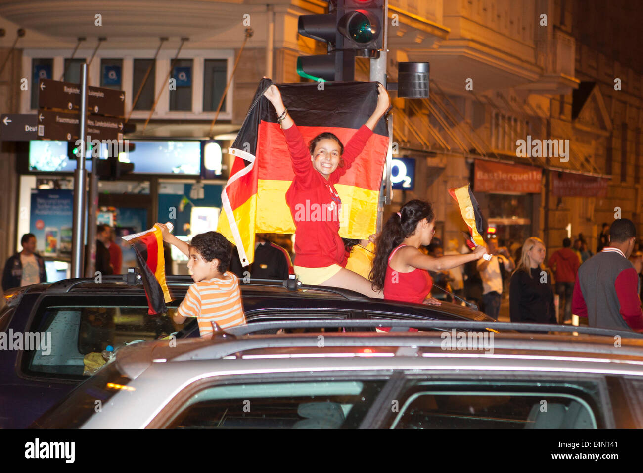 Wiesbaden, Germany. 14th July, 2014. Germany wins the FIFA World Cup 2014. People in their cars cheering and celebrating in downtown Wiesbaden after Germanys victory against Argentina in the final match. Some motion blur. Credit:  Oliver Kessler/Alamy Live News Stock Photo