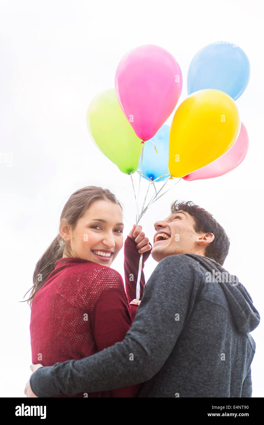 Young couple with balloons Stock Photo - Alamy
