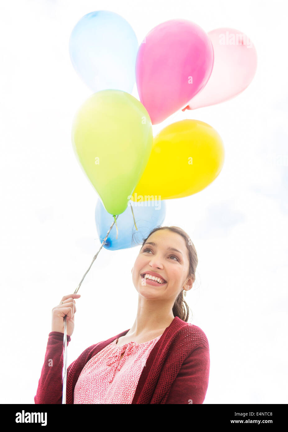 Young woman with colorful balloons Stock Photo