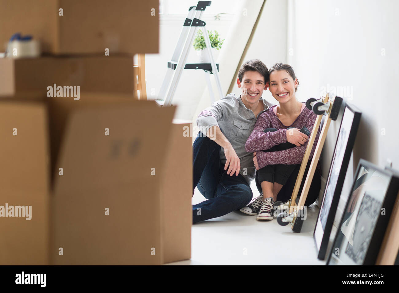 Couple in new home Stock Photo - Alamy