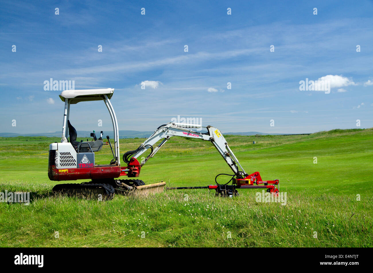 Digging machine, Royal Porthcawl Golf Club, South Wales, UK. Stock Photo