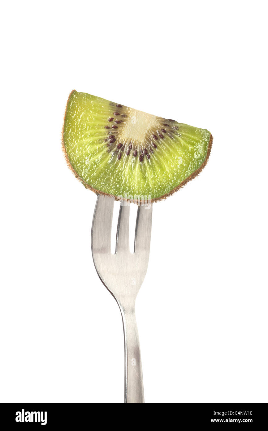 Slice of kiwifruit held by a fork isolated on white background Stock Photo