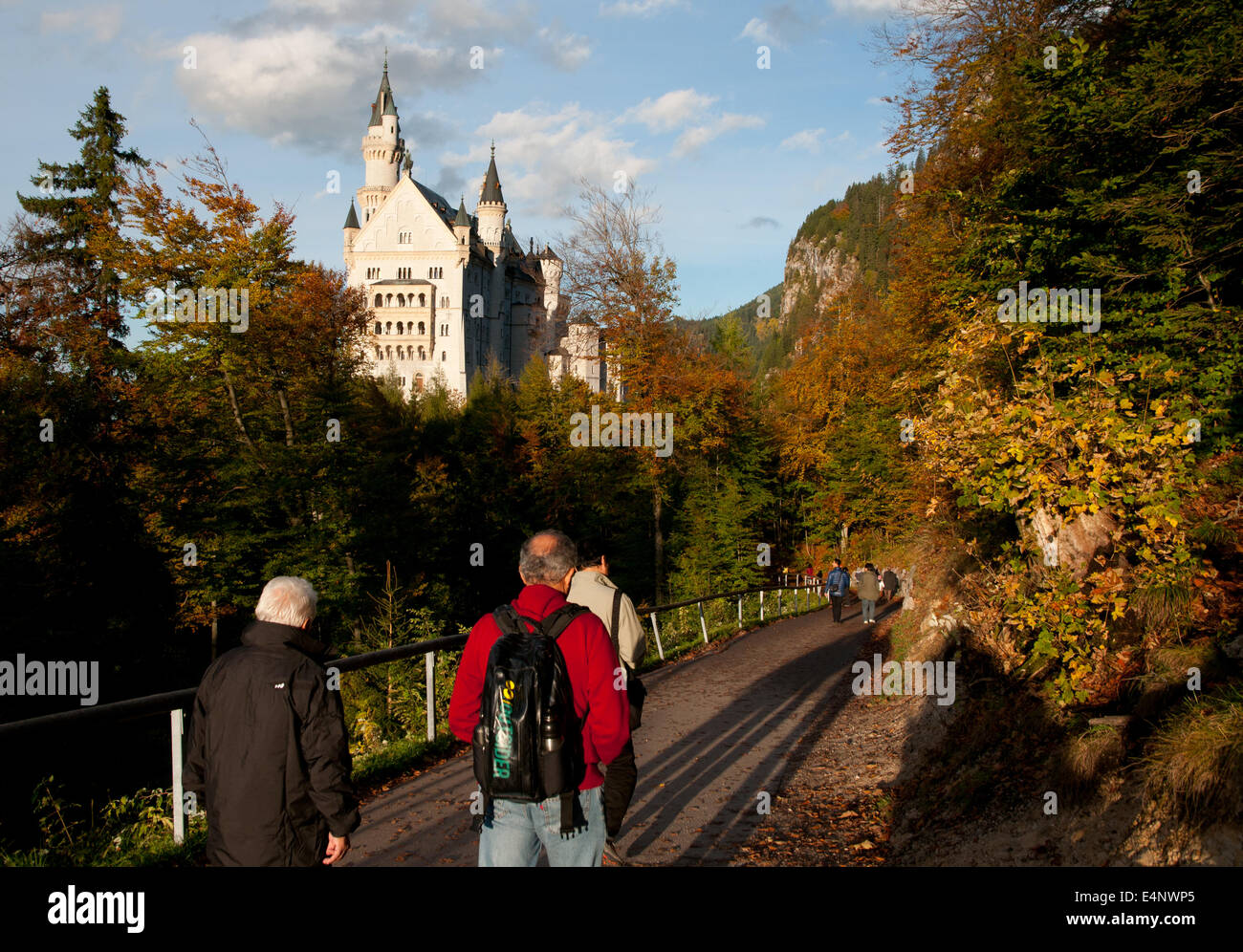 Tourists walking to Neuschwanstein fairytale castle, Bavaria, Germany Stock Photo