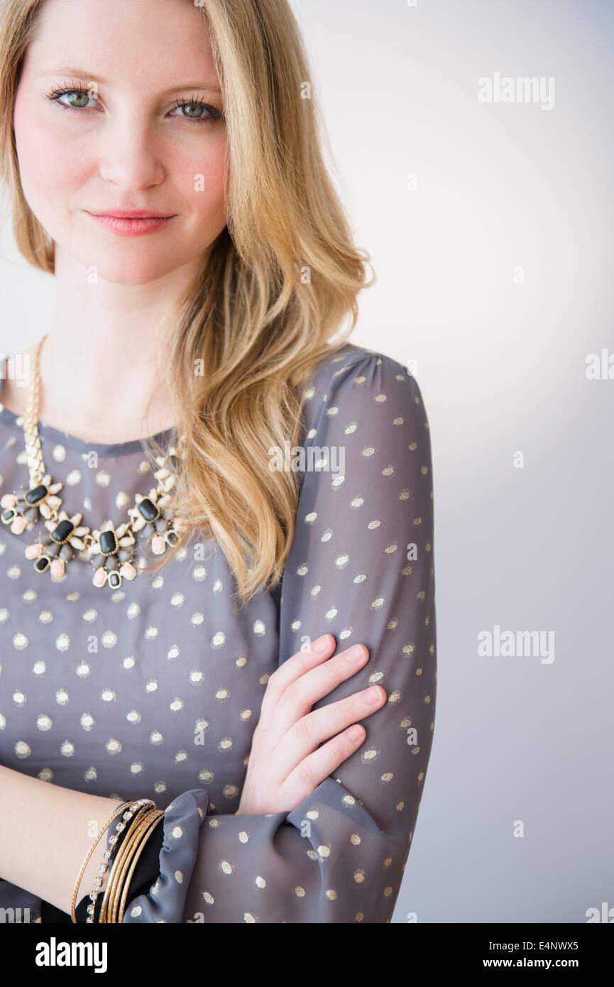 Blonde hair arms crossed hi-res stock photography and images - Alamy